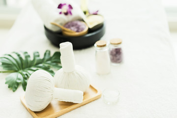 Fototapeta na wymiar Spa treatments body care on the massage bed.Thai herbal ball set