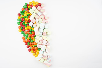 Creative arrangements of confectionery or candies on a white background. Flat lay.