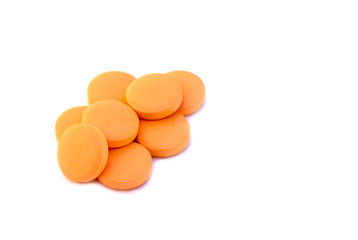 Orange pills isolated on white background