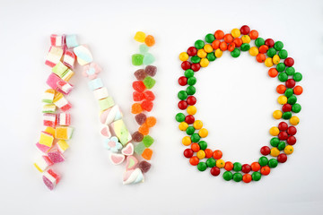 Creative arrangements of confectionery or candies on a white background. Flat lay.