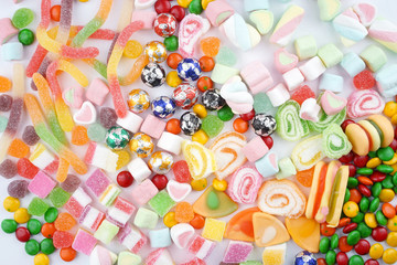 Fototapeta na wymiar Creative arrangements of confectionery or candies on a white background. Flat lay.