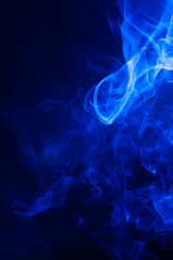 Blue smoke on black background.