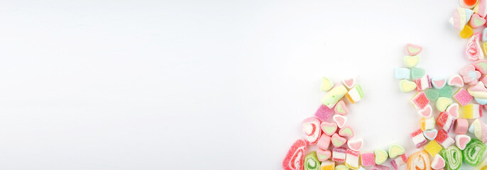 Creative arrangements of confectionery or candies on a white background. Flat lay.