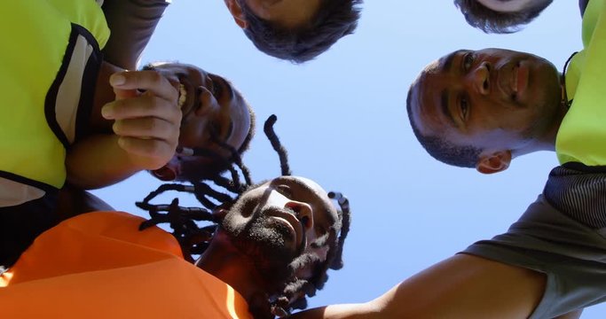 Soccer players forming a huddle 4k