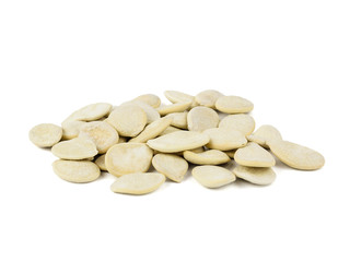 Small bunch of pumpkin seeds isolated on white background.