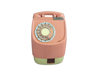 Isolation of the beautiful old pink telephone with rotary dial.