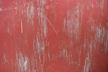 Abstract red metal background painted in red with scratches