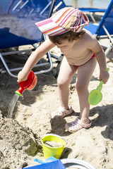 Little girl play on the beach