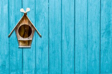 wood mailbox on blue wooden plank background. letters and messages, postman vintage view