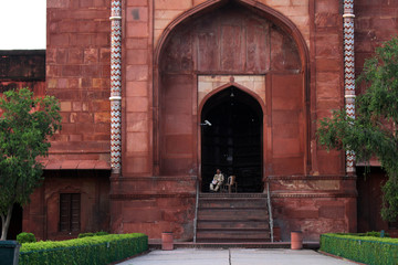 The officer guarding a gate in the complex of Taj Mahal.