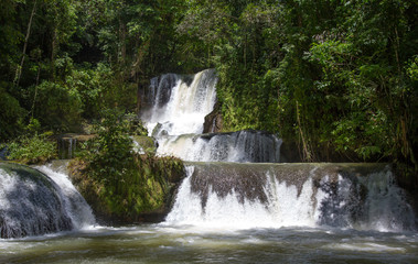 Fototapeta na wymiar Scenic waterfalls and lush vegetation in Jamaica