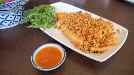 Fried squid with garlic and pepper.