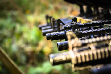 Paintball rifles arranged in line