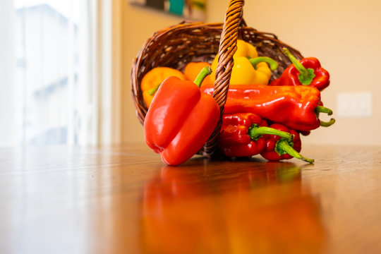 Yellow and Red Bell Peppers in Basket