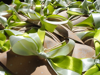 Handmade paper favors with green and white bow