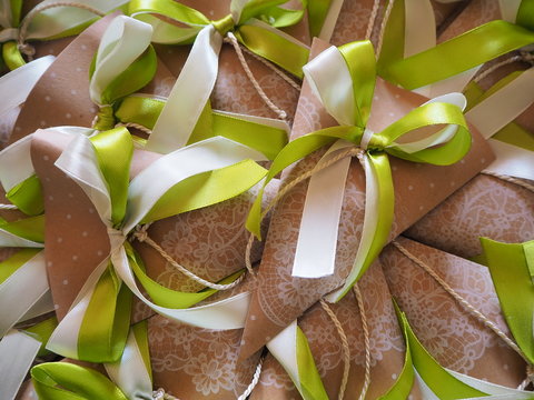 Handmade paper favors with green and white bow