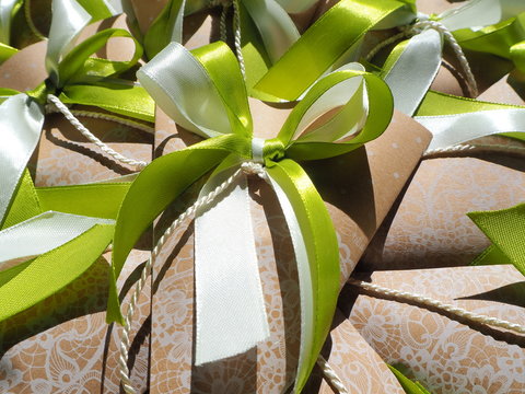 Handmade paper favors with green and white bow