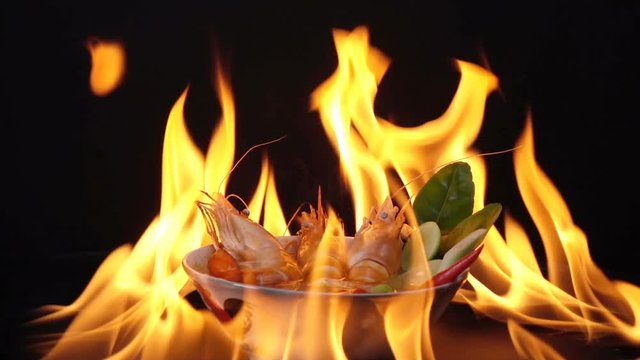 tom yum kung thai food , shrimp sea food spicy soup on fire flaming