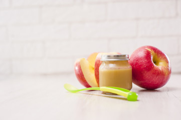 Organic baby food. Puree with fruit. Baby food on white