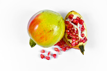 Pomegranate fruit with seeds on white background