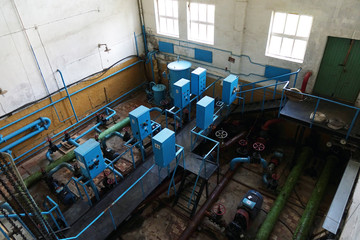 The old sewage treatment plant. Old and damaged sewage treatment plant devastated. Rusty valves.