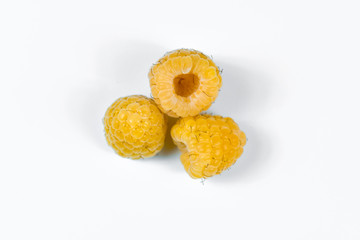 Set of yellow raspberry berry fruits on white background.