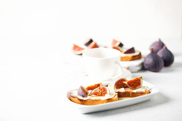 Bruschetta with figs, ricotta (cream cheese),  honey. Healthy food concept.  Top view.