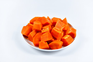 Tropical papaya fruit slices in dish