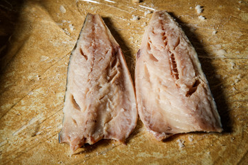 top view on raw mackerel fillet lies on food film