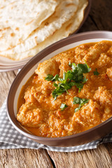Chicken Changezi is a mughalai dish in which chicken is cooked in wonderful flavours of onion,almond and cashew paste along with curd and cream  close-up on a plate. Vertical