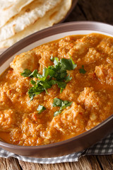 Chicken Changezi - The highly popular dish from the streets of old Delhi close-up on a plate. Vertical