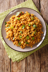 Chicken Keema minced chicken sauteed in onion, tomatoes and flavored with aromatic Indian spices closeup. Vertical top view