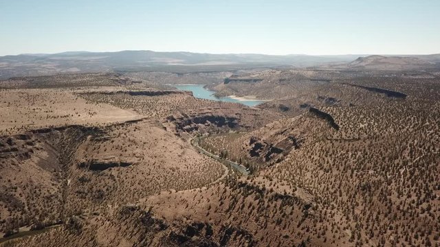 Flight in the high desert of central Oregon over premier flyfishing trout stream in the crooked river canyon