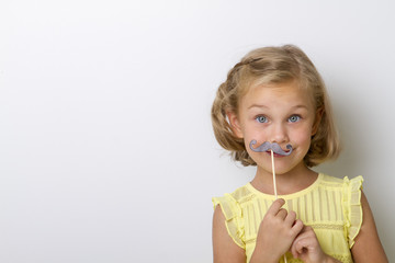 Free time for fun. Close up portrait small girl with fake mustache with plump