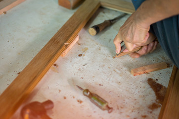 The work of technicians who are repairing woodwork.