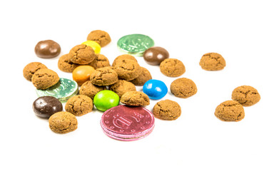 Bunch of pepernoten cookies, sweets and chocolate money frontal view