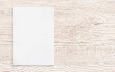 White paper sheet on wood.