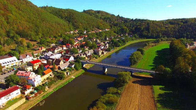 Camera flight over The Berounka river near Zbecno. Beautiful natural park in Czech Republic. European landmarks from above.