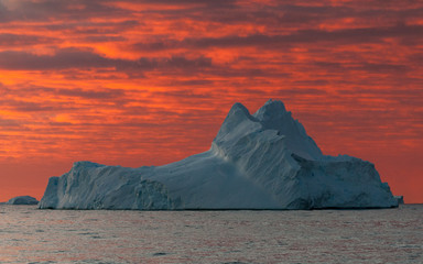 Sunset over weathered iceberg,  Antarctica © Graeme