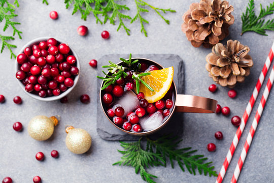 Christmas Moscow Mule, Holiday Drink In A Copper Mug. Grey Stone Background. Top View.