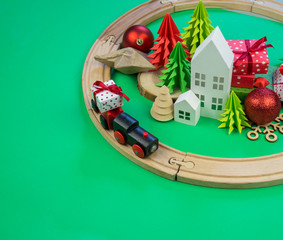 toy wooden train carries a box with gift the child