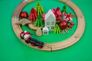 toy wooden train carries a box with gift the child