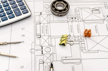 Engineer project and different tools on it, closeup