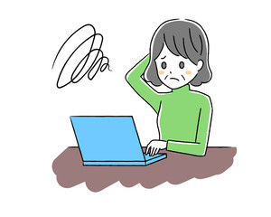 ノートパソコンとシニア女性