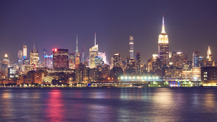 New York City waterfront panorama at night, USA.