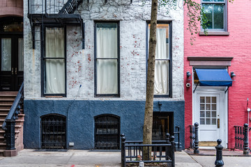 Old Greenwich Village apartment buildings in New York - obrazy, fototapety, plakaty
