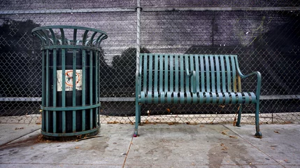 Fototapeten trash can and bench on urban street © jdoms