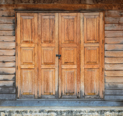 Old wooden house door with lock