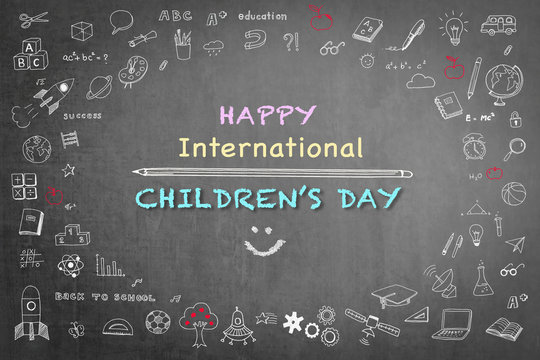 Happy international children's day greeting with doodle on black chalkboard