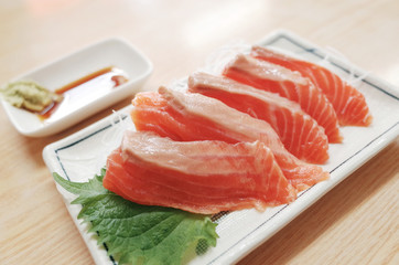 Fresh Raw Salmon Slide on Dish Serve with Wasabi and Sauce 